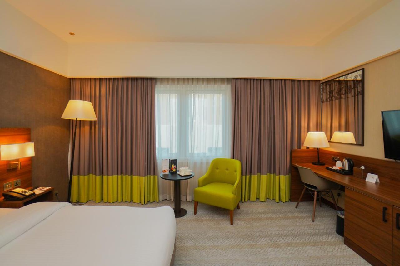 The Grand Lux Hotel Ad-Dauha Zewnętrze zdjęcie A room at the hotel