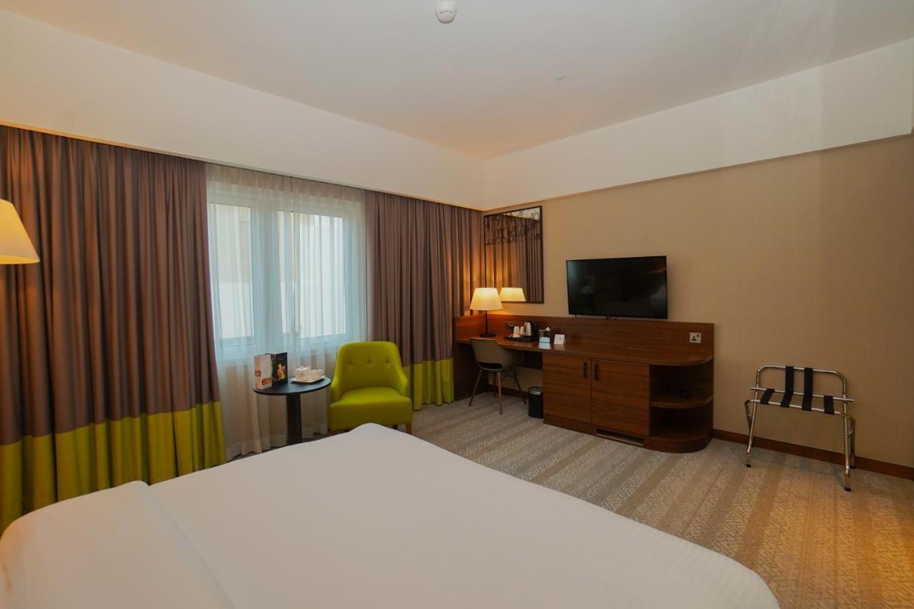 The Grand Lux Hotel Ad-Dauha Zewnętrze zdjęcie A room at the hotel