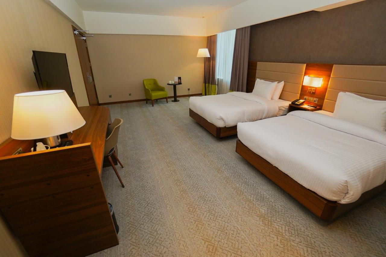 The Grand Lux Hotel Ad-Dauha Zewnętrze zdjęcie A room at the hotel