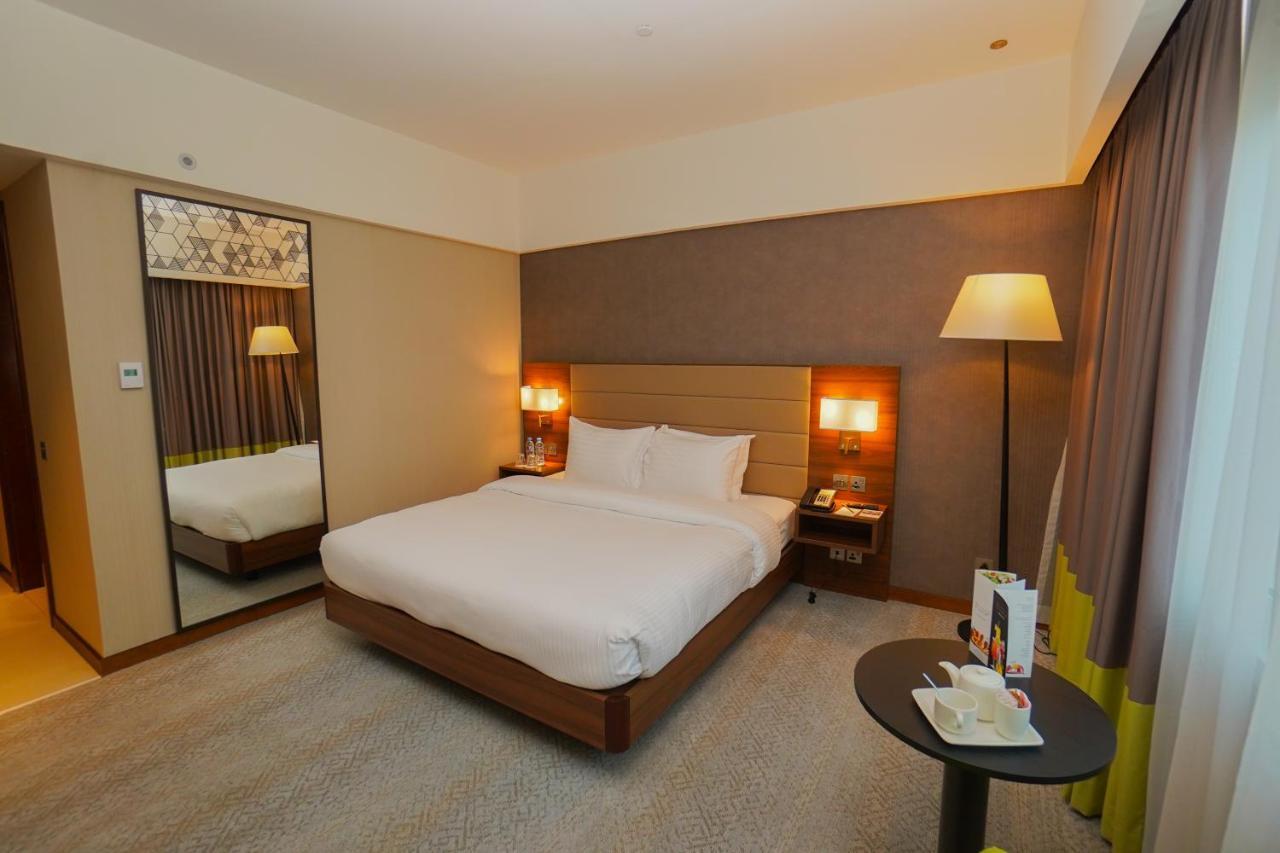 The Grand Lux Hotel Ad-Dauha Zewnętrze zdjęcie A room at the hotel